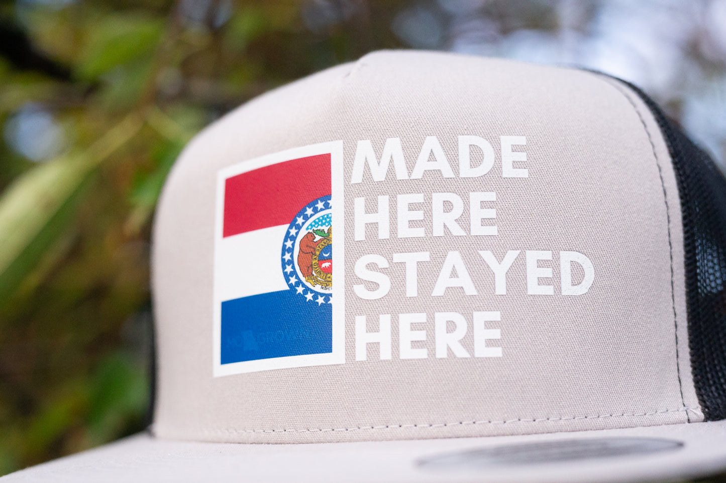"MADE HERE, STAYED HERE" FLATBILL SNAPBACK TRUCKER HAT