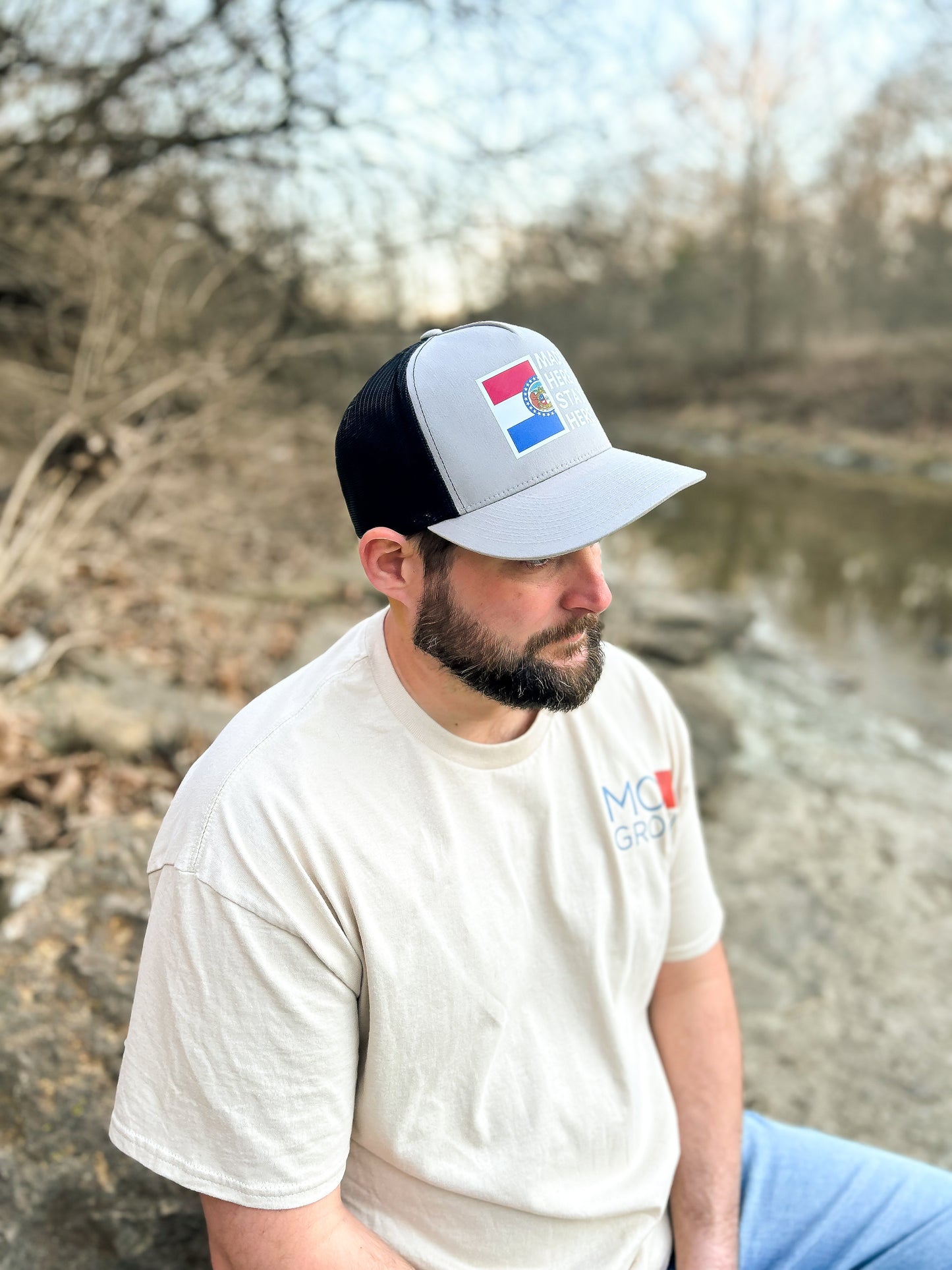 "MADE HERE, STAYED HERE" FLATBILL SNAPBACK TRUCKER HAT